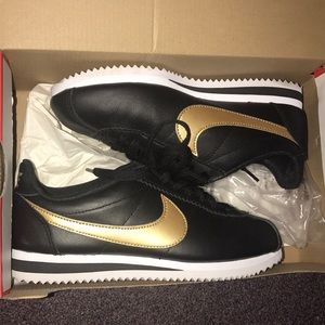 Black and Gold Nike Cortez